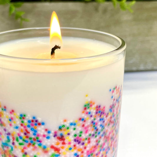 This irresistible birthday cake-scented candle stands tall, adorned with colorful sprinkles, emitting a warm glow. Its handcrafted charm fills the air with nostalgia and joy. Perfectly capturing the spirit of a festive occasion in a delightful aroma. Best birthday candle in Parker Colorado