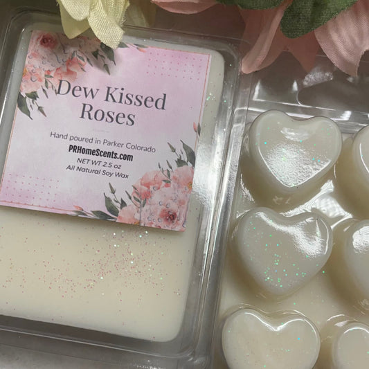Indulge in the luxurious and exclusive aromas of our Dew Kissed Roses soy candle. Made with 100% all natural soy, this candle will fill your space with the delicate scent of freshly kissed roses while providing a clean and eco-friendly burn. Elevate your senses and enhance your space with our premium candle.  100% All Natural Soy Wax Phthalate Free Clean Scent