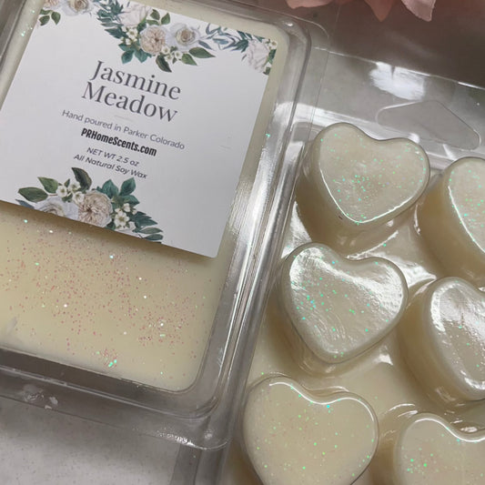 Jasmine Meadow soy wax melts. Made with 100% all natural soy, this fragrance will transport you to a peaceful meadow filled with the sweet fragrance of jasmine. Elevate your senses as they melt in your favorite wax melter.
