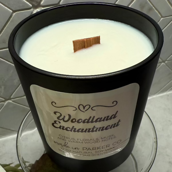 Woodland Enchantment soy wax candle with citrus, florals, musk, and wood notes. Clean, non-toxic, eco-friendly, with a crackling woodwick.