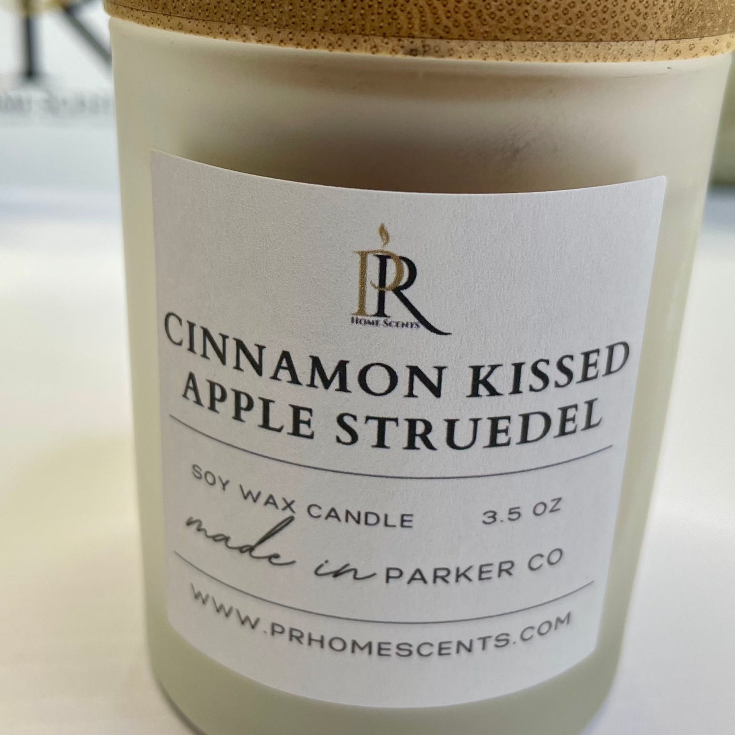 Delight in cozy evenings with our 'Cinnamon Kissed Apple Strudel' soy wax candle. Experience the warm embrace of apple, cinnamon, clove, cream, and vanilla. Elevate your space with the comforting scent of freshly baked goodness. Perfect for creating a cozy ambiance.
